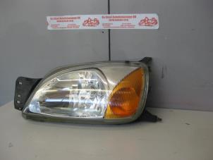 Used Headlight, left Ford Fiesta 4 1.3i Price on request offered by de Graaf autodemontage B.V.
