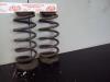 Rear coil spring from a Kia Picanto (BA), 2004 / 2011 1.0 12V, Hatchback, Petrol, 999cc, 45kW (61pk), FWD, G4HE, 2004-04 / 2011-04, BAGM21; BAH51; BAM51 2006