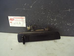 Used Door handle 2-door, right Mitsubishi Colt (CJ) 1.6 GLXi 16V Price on request offered by de Graaf autodemontage B.V.