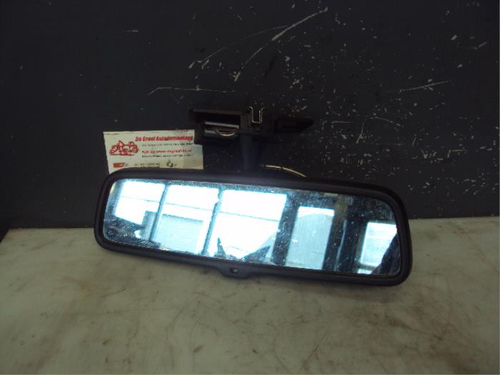 Rear view mirror from a Opel Astra H SW (L35) 1.3 CDTI 16V Ecotec 2006