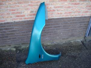Used Front wing, right Mazda 323 F (BA14) 1.8i GLX,GT 16V Price on request offered by de Graaf autodemontage B.V.