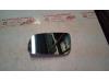 Mirror glass, left from a Seat Arosa 2000
