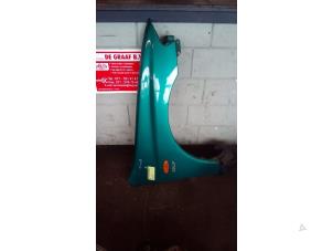 Used Front wing, right Mazda 323 P (BA15) 1.5i 16V Price on request offered by de Graaf autodemontage B.V.