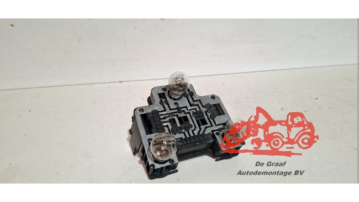 Tail light bulb cover holder