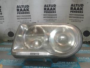 Used Headlight, left Chrysler 300 C Price on request offered by "Altijd Raak" Penders