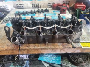 Used Cylinder head Mitsubishi L-300 (P..) 2.5D Price on request offered by "Altijd Raak" Penders