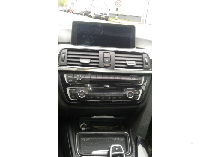 Reproductor de CD y radio de un BMW 4 serie (F33) 428i xDrive 2.0 Turbo 16V 2015