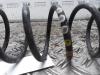 Rear coil spring from a Seat Ibiza ST (6J8) 1.2 TDI Ecomotive 2011