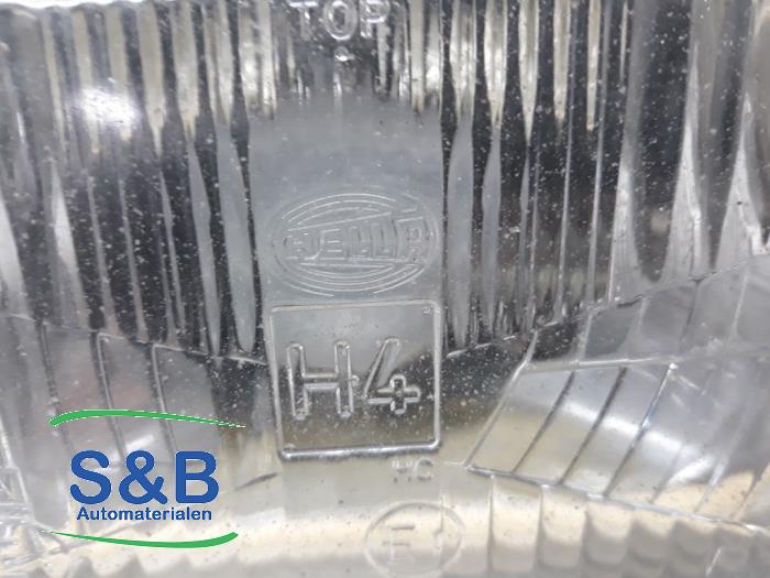 Headlight, left Audi - 857941663 HELLA - Schaap & Bron