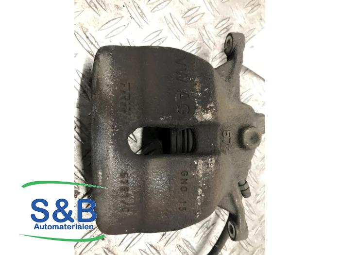 Front brake calliper, left from a Volkswagen Caddy Combi IV 2.0 TDI 102 2018