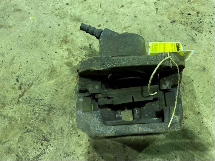 Front brake calliper, left from a Renault Megane (BA/SA)  2000