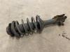 Front shock absorber rod, left from a Hyundai Accent 1.3i 12V 2001