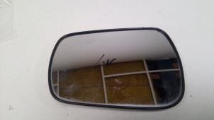 Used Mirror glass, left Ford Fiesta 5 (JD/JH) 1.3 Price € 10,00 Margin scheme offered by F. van den Mosselaar autodemontage