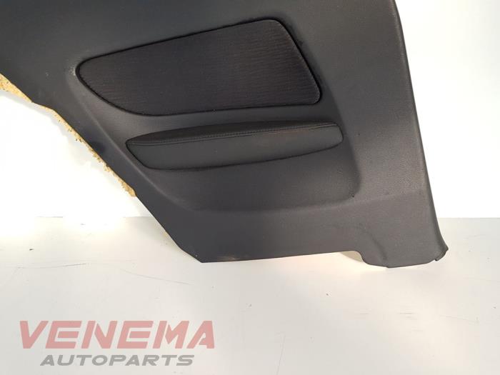 Side panel trim, rear left from a BMW 1 serie (E81) 118i 16V 2010