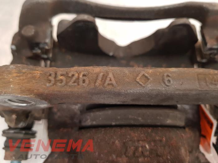 Front brake calliper, left from a MINI Mini (R56) 1.6 16V Cooper 2012