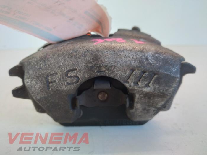 Front brake calliper, left from a Volkswagen Polo V (6R) 1.2 TSI 2013