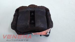 Used Front brake calliper, left Renault Twingo II (CN) 1.2 16V Price € 39,99 Margin scheme offered by Venema Autoparts