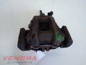 Used Rear brake calliper, left BMW 1 serie (F20) 114i 1.6 16V Price € 49,99 Margin scheme offered by Venema Autoparts