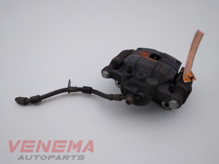 Front brake calliper, left from a Ford Fiesta 6 (JA8) 1.0 EcoBoost 12V 100 2014