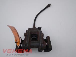 Used Rear brake calliper, left BMW 1 serie (F20) 116i 1.6 16V Price € 24,99 Margin scheme offered by Venema Autoparts