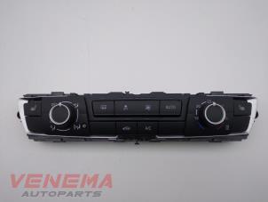 Usados Panel de control de calefacción BMW 1 serie (F20) 116i 1.5 12V Precio € 149,99 Norma de margen ofrecido por Venema Autoparts
