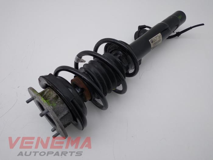 Front shock absorber rod, left from a BMW Z4 Roadster (E89) sDrive 18i 2.0 16V 2014