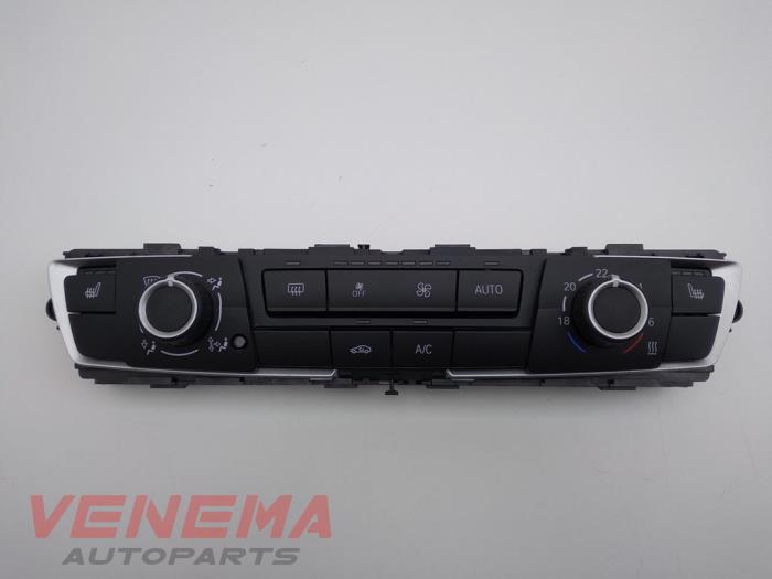 Panel de control de calefacción de un BMW 1 serie (F20) 118i 1.5 TwinPower 12V 2018