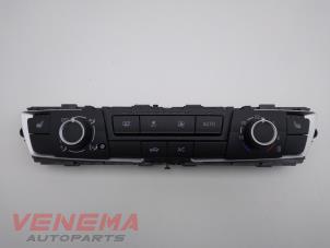 Usados Panel de control de calefacción BMW 1 serie (F20) 118i 1.5 TwinPower 12V Precio € 149,99 Norma de margen ofrecido por Venema Autoparts