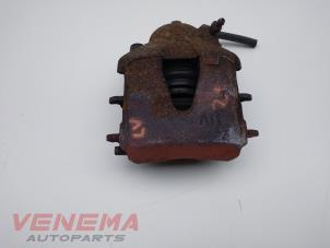 Used Front brake calliper, left Volkswagen Up! (121) 1.0 12V 60 Price € 9,99 Margin scheme offered by Venema Autoparts