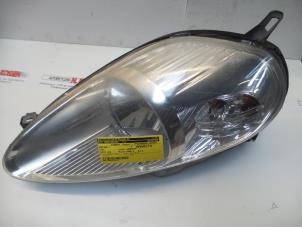 Used Headlight, left Fiat Grande Punto (199) 1.3 JTD Multijet 16V Price on request offered by N Kossen Autorecycling BV