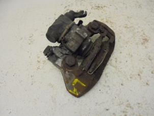 Used Rear brake calliper, left Renault Clio Price on request offered by N Kossen Autorecycling BV