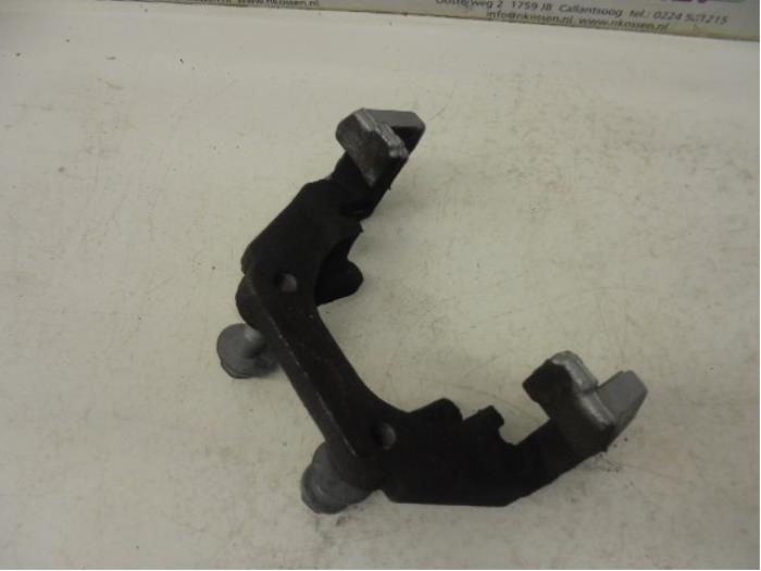 Rear brake calliperholder, left from a BMW 7 serie (F01/02/03/04) 730d 24V 2010