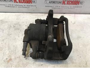 Used Front brake calliper, left Opel Corsa D 1.4 16V Twinport Price on request offered by N Kossen Autorecycling BV
