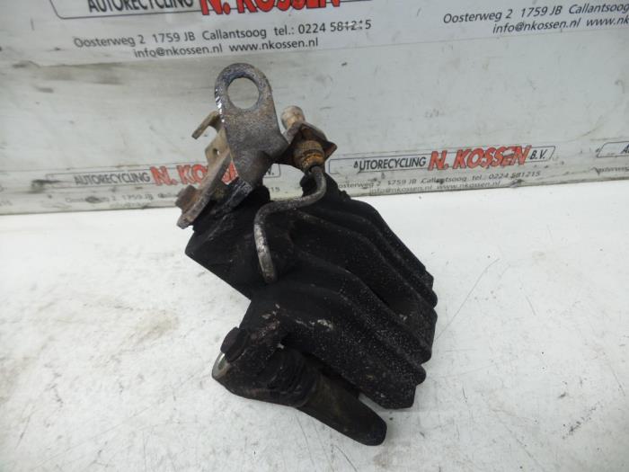 Rear brake calliper, left from a Seat Leon (1P1) 1.9 TDI 105 2009