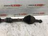 Front drive shaft, left from a Nissan Note (E11) 1.6 16V 2010