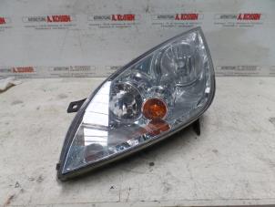 Used Headlight, left Mitsubishi Colt Price on request offered by N Kossen Autorecycling BV