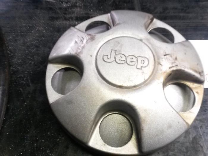 Wheel cover (spare) from a Jeep Cherokee/Liberty (KJ) 2.5 CRD 16V 2004