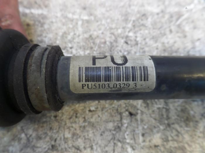 Front drive shaft, left from a Opel Tigra 2005