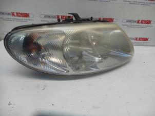 Used Headlight, right Chrysler Voyager Price on request offered by N Kossen Autorecycling BV