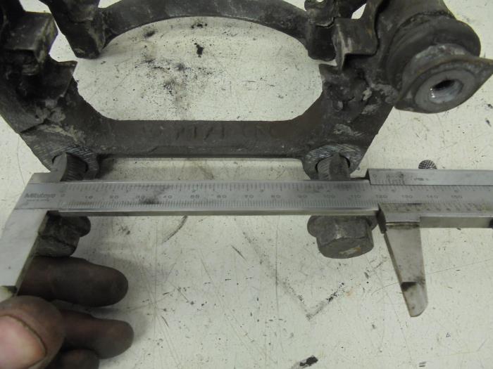 Rear brake calliperholder, left from a Volkswagen Transporter T5 2.0 TDI DRF 2013