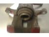 Rear brake calliper, left from a Kia Sportage (SL) 2.0 CVVT 16V 4x2 2012