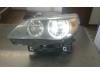 Headlight, left from a BMW 5 serie Touring (E61) 525d 24V 2006