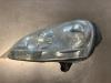Headlight, left from a Volkswagen Golf V (1K1) 1.6 FSI 16V 2004