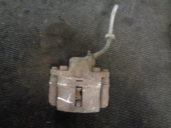 Front brake calliper, left from a Renault Twingo (C06) 1.2 16V 2001