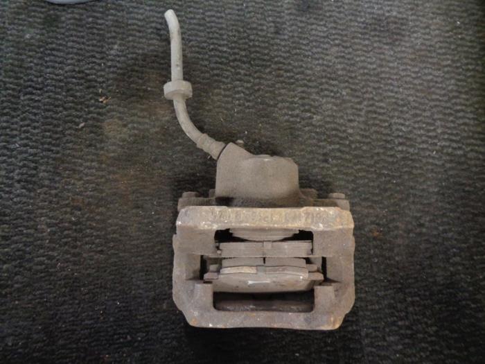Front brake calliper, left from a Renault Twingo (C06) 1.2 16V 2001