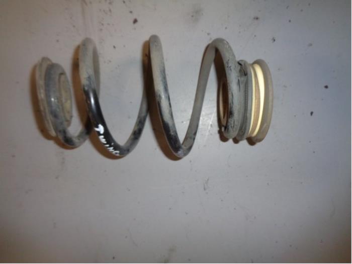 Rear coil spring from a Renault Twingo II (CN) 1.5 dCi 75 FAP 2012