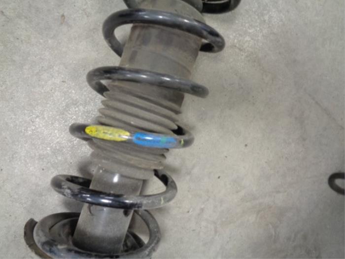 Fronts shock absorber, left from a Nissan Micra (K13)  2012