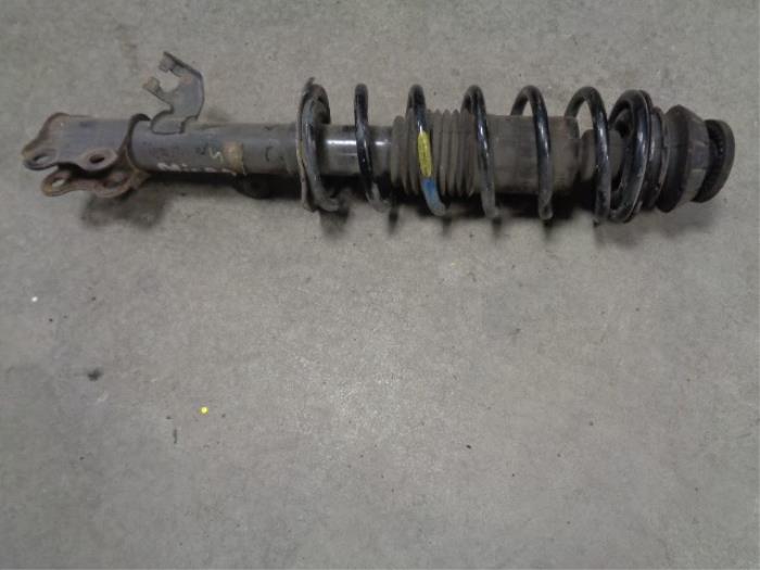 Fronts shock absorber, left from a Nissan Micra (K13)  2012