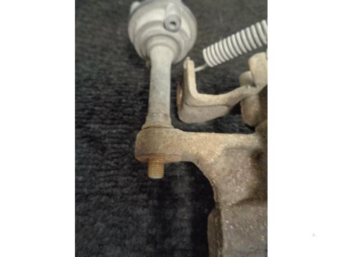 Rear brake calliper, left from a Opel Astra J GTC (PD2/PF2) 2.0 CDTI 16V ecoFLEX 2011