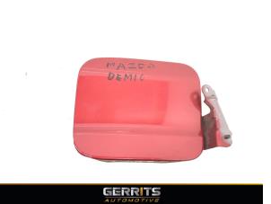 Used Tank cap cover Mazda Demio (DW) 1.5 16V Price € 21,98 Margin scheme offered by Gerrits Automotive